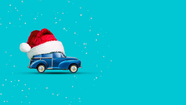 istock Retro car in Santa Hat on a blue background. Copy space. Place for text. New Year's banner. 1355965738