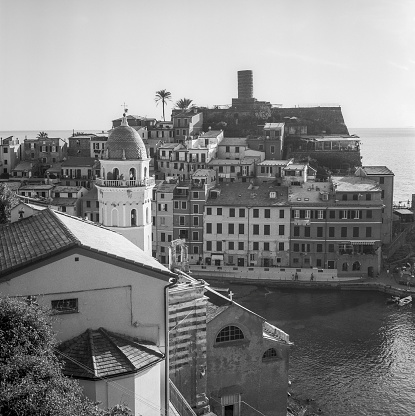 The harbour of the village of Vernazza in the Cinque Terre in Italy, shot with analogue black and white film technique
