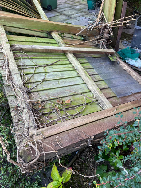 istock Close-up image of fallen garden fence panel blown over by wind during storm, hurricane damage, elevated view 1355969351