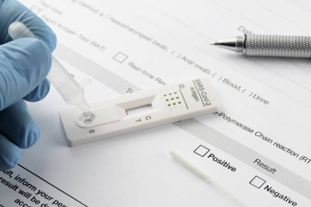 istock Performing a rapid antigen test for SARS-CoV-2, COVID-19 1355969379