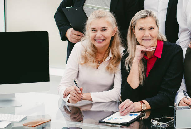 istock group of experienced employees at the workplace in the office 1355970770