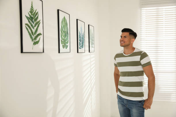 istock Happy man at exhibition in art gallery 1355971246