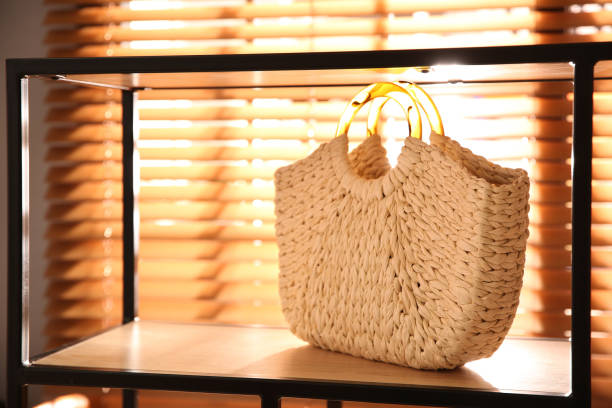 istock Stylish woman's bag on shelf in boutique 1355971887