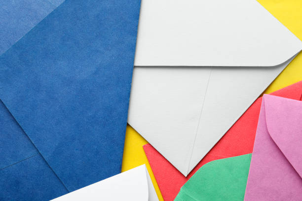 istock Colorful paper envelopes as background, top view 1355972308