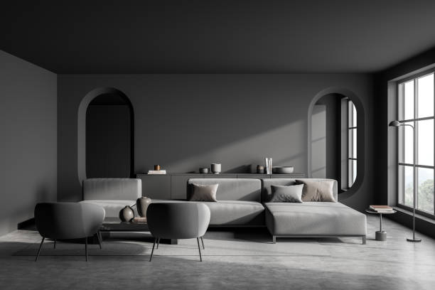 istock Modern dark grey living room with two oval mirrors 1355973805