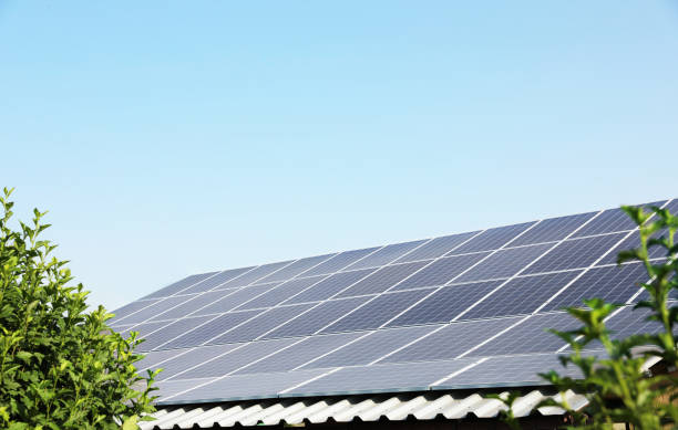 istock House with installed solar panels on roof. Alternative energy source 1355973950