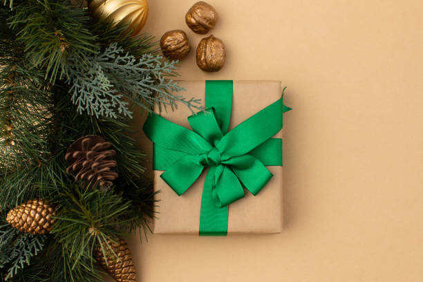 istock Gift boxes wrapped in craft paper with ribbon and bow 1355974757