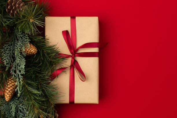 istock Gift boxes wrapped in craft paper with ribbon and bow 1355974779