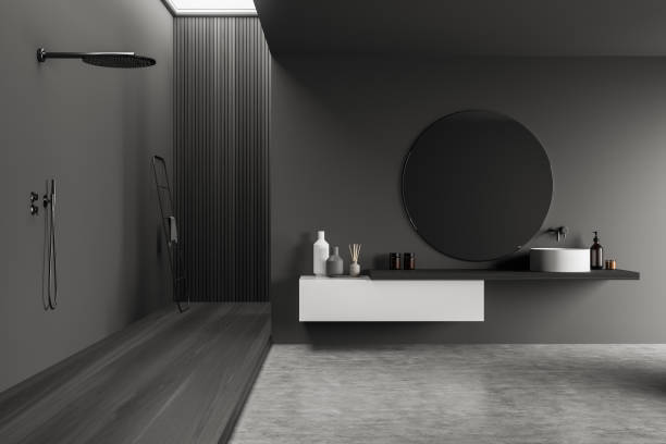 istock Grey bathroom interior with minimalist sink and wooden shower 1355974875