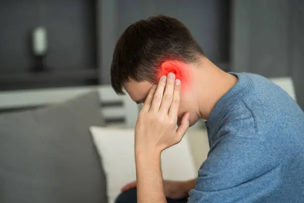 Photo of Man with earache, ear pain at home