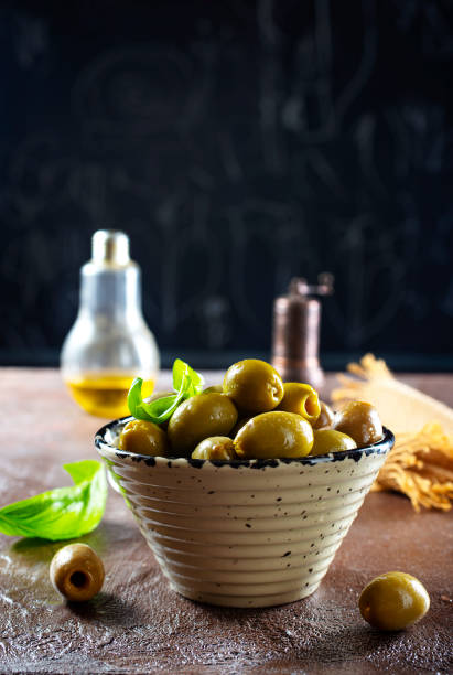 istock green olives in olive oil 1355976857