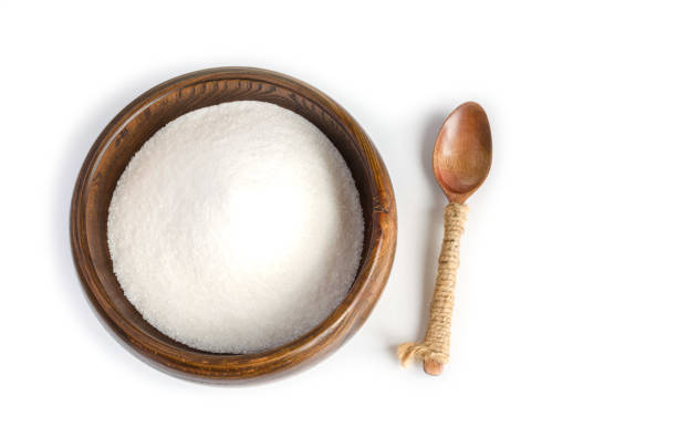 istock Sugar sand in wooden Cup on white background. 1355977406