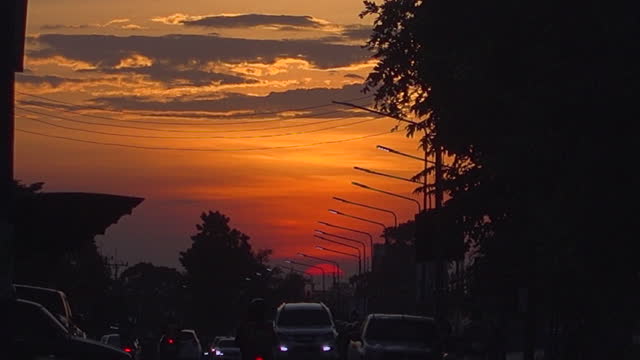 Sunset On Road In City