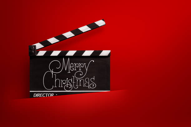 istock Merry Christmas, Handwriting on film slate. red background. 1355980868