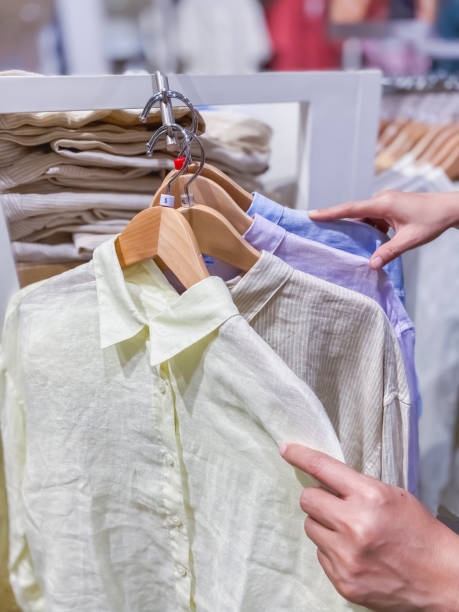istock New shirts hanging in the store 1355982020