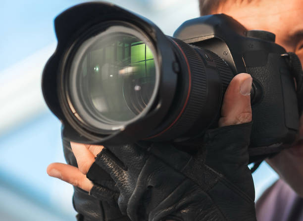 istock professional photographer taking a picture on the camera 1355982079