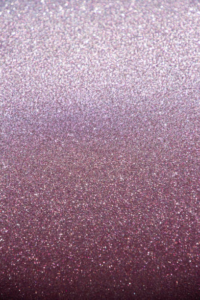 istock modern and Abstract background made with illuminating pink glittering sparkles 1355982115