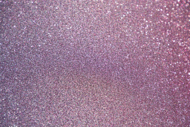 istock bokeh glitter xmas or celebration greeting card background colored puple and pink modern style 1355982727