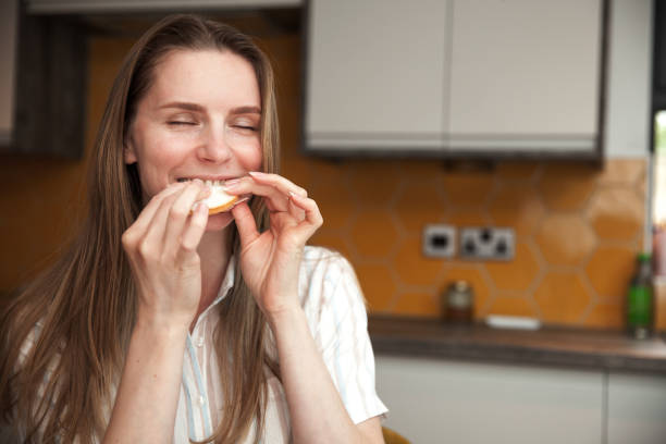istock Woman Eating a Toast Sandwich 1355983974