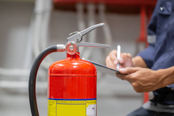 istock Engineer are checking and inspection a fire extinguishers tank in the fire control room for safety training and fire prevention. 1355985065