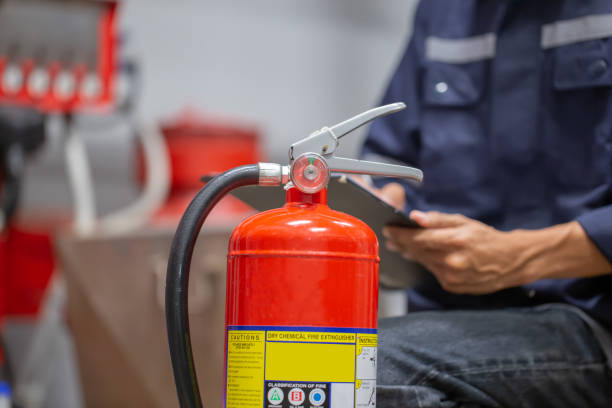 istock Engineer are checking and inspection a fire extinguishers tank in the fire control room for safety training and fire prevention. 1355985067