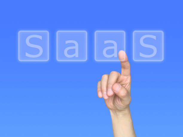 istock Right hand touching the letters in SaaS 1355988612