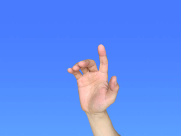 istock A man's right hand trying to push something. 1355988637