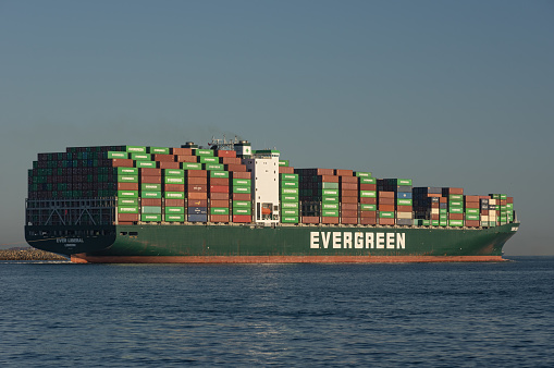 Port of los Angeles, California, USA - November 27, 2021: image of an Evergreen Marine Corporation container ship Ever Liberal shown departing.