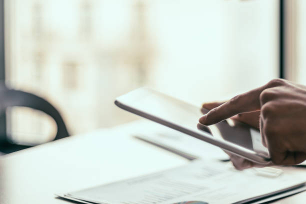 istock young woman using her smartphone at work in the office 1355990241
