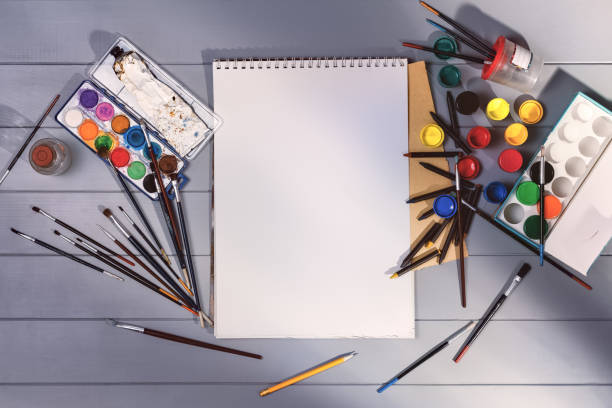 istock Drawing or painting in art studio. Top view mock-up background 1355990850
