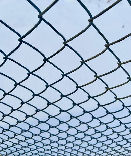 istock Close up of chain link fence 1355992246