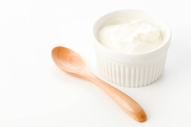 Fresh greek yogurt in Ceramic white Ramequin on white background