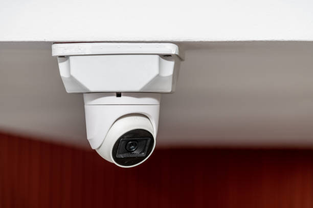 White ceiling mounted security camera with night vision stock photo