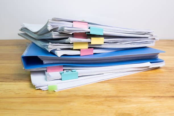 istock blue files folder and paper for business on wood table 1355995678