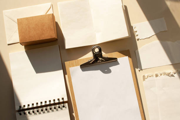istock Blank forms, notebooks, mockup template. Flat Lay style. Contrasting shadows trend 1355995894