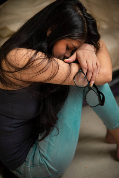 https://media.istockphoto.com/id/1355998962/photo/depressed-indian-young-woman-sitting-alone-and-crying-at-home.jpg?s=612x612&amp;w=0&amp;k=20&amp;c=BQpsMkeWKONsVsyvxGpVT2ff3ZglcNgOG_-_WScPGuc=