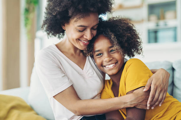 Loving mother Smiling mother embracing her daughter pre adolescent child stock pictures, royalty-free photos & images