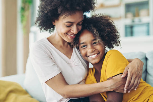 Loving mother Smiling mother embracing her daughter happy peaceful woman stock pictures, royalty-free photos & images