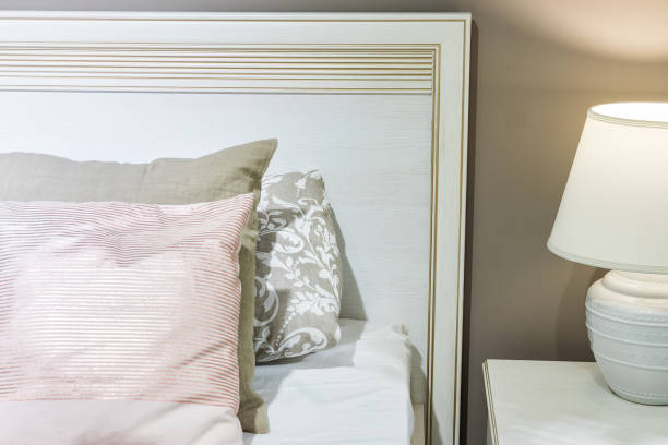 istock Bedroom interior, bed with pillows and blanket, lamp is on the bedside table 1355999152