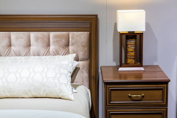 istock Bedroom interior, bed with pillows and blanket, lamp is on the bedside table 1355999201