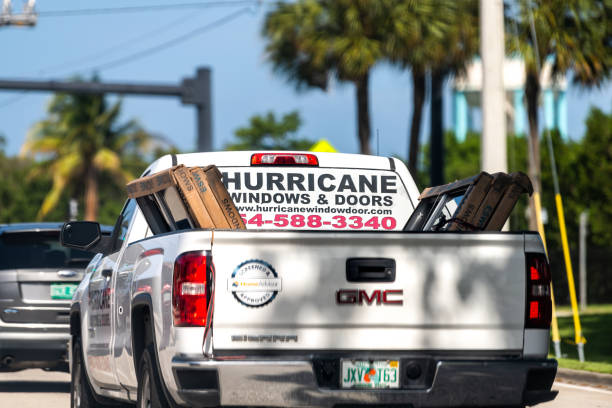 Hurricane windows and doors advertisement sign on truck service business company to install shutters against storm in Miami, Florida Hollywood, USA - July 8, 2021: Hurricane windows and doors advertisement sign on truck service business company to install shutters against storm in Miami, Florida small florida home stock pictures, royalty-free photos & images
