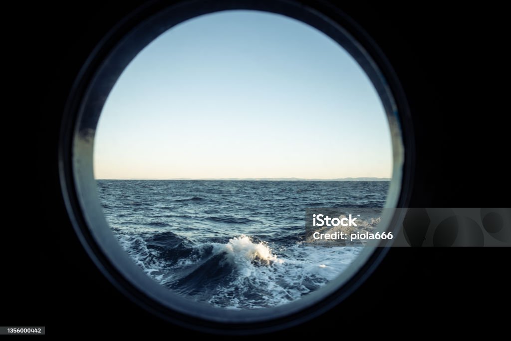 View on a rough sea, with waves of the open ocean from a boat View on a rough sea, with waves of the open ocean from a boat. Dramatic landscapes of the Atlantic Ocean. Circle Stock Photo