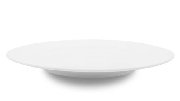 istock White circle ceramics plate isolated on white background. 1356003278