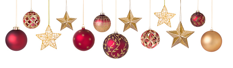 Christmas red and gold baubles and stars  isolated on white