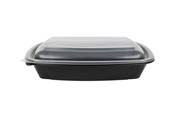 Disposable black plastic lunch box container isolated on white background. Plastic container isolated. Single-use plastic packaging stock photo