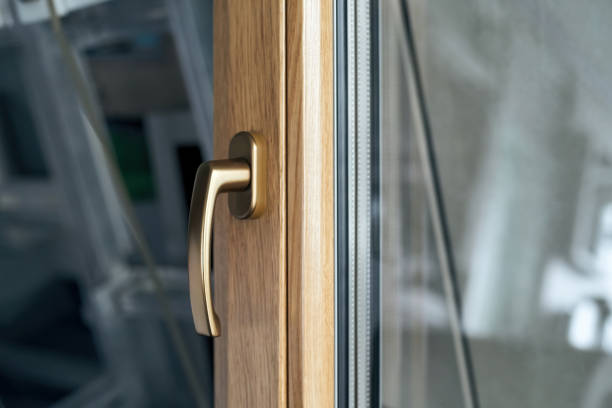 istock stylish handle on the window frame in gold color 1356006340