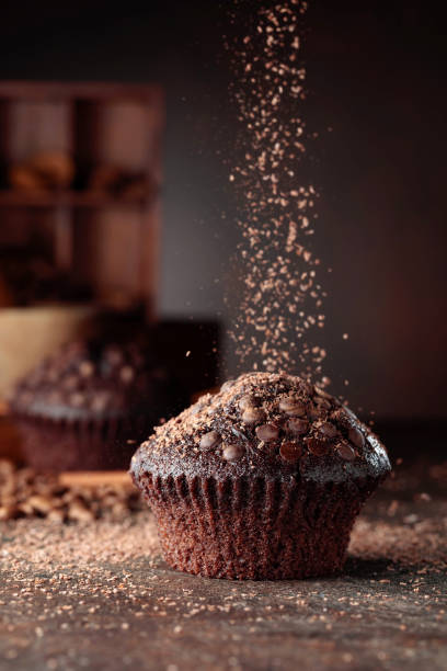 istock Chocolate muffins on a brown background. 1356007123