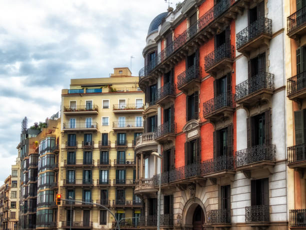 Geometric shapes of facade of modernist residential building with french balconies in Barcelona, Spain.