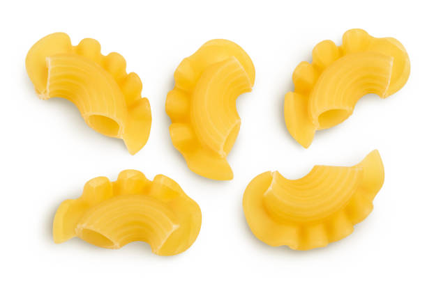 istock Pasta cornetti creste macaroni isolated on white background with clipping path and full depth of field. Top view. Flat lay 1356007958