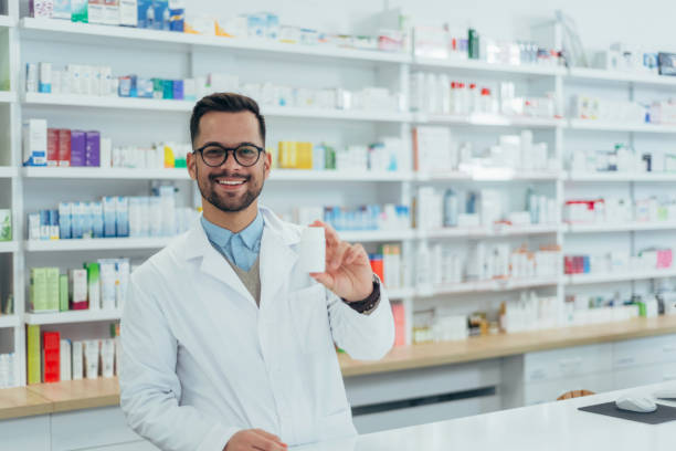 istock Portrait of a handsome pharmacist working in a pharmacy 1356010187
